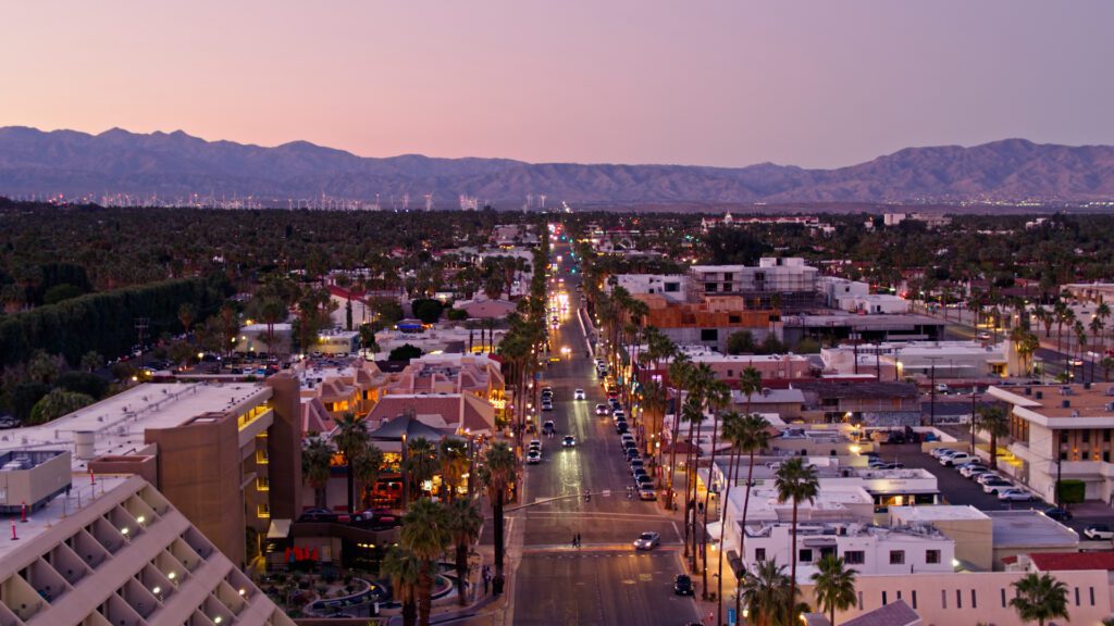 Aerial shot of Downtown Palm Springs, California at sunset, looking towards the wind farm in San Gorgonio Pass.

Authorization was obtained from the FAA for this operation in restricted airspace.